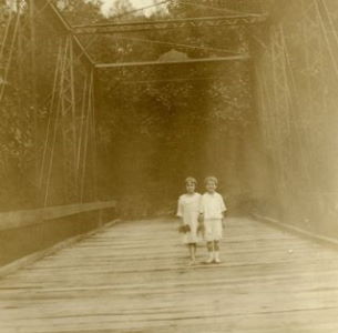 People posing with bridges