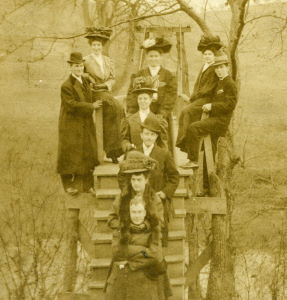 People posing with bridges