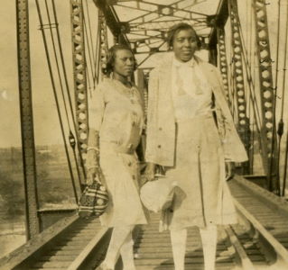People posing with bridges