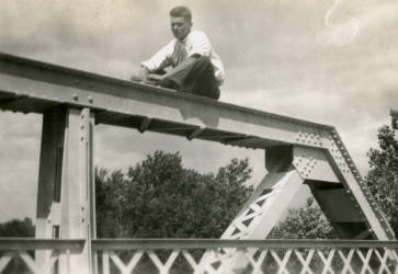 People posing with bridges